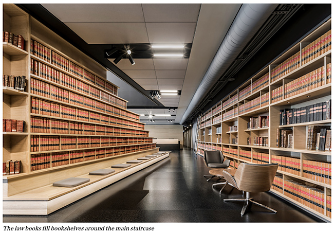 The law books fill bookshelves around the main staircase