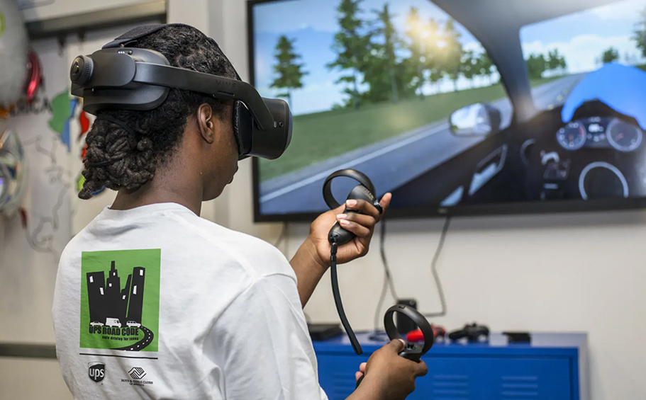 A young person learns more about how to drive using virtual reality